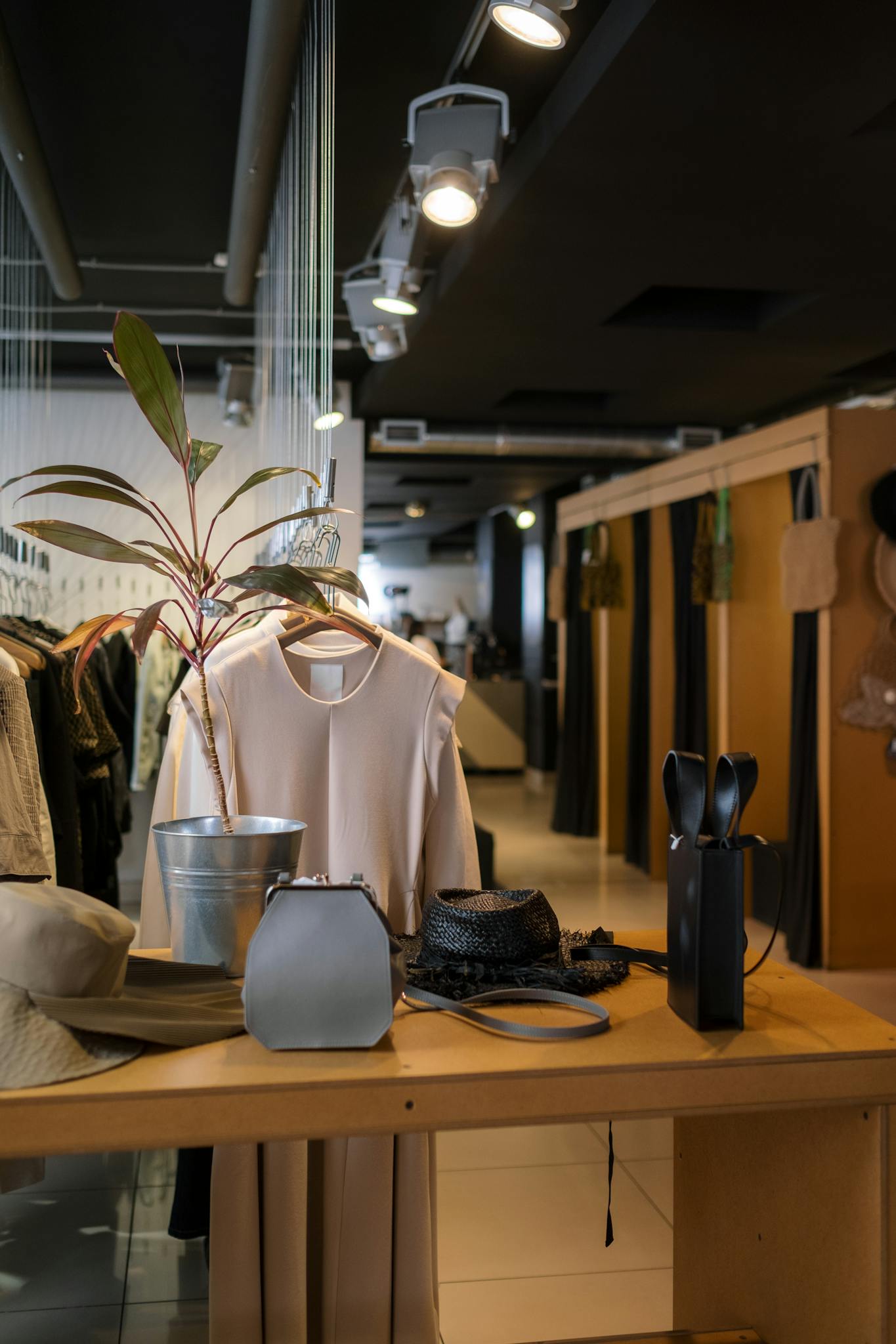 Stylish clothing store interior with modern retail display showcasing fashion and accessories.